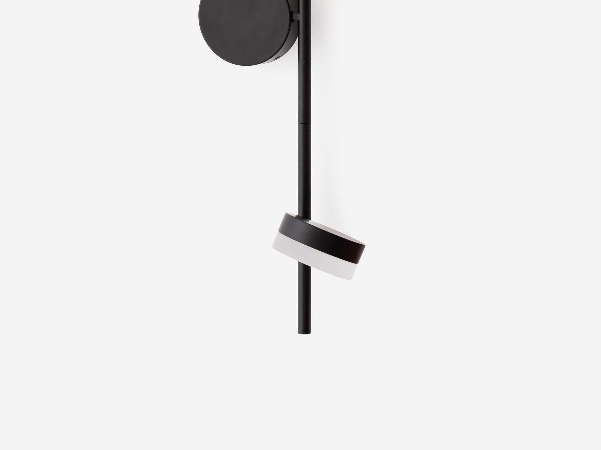 A hand demonstrates how to move the double Row wall sconce